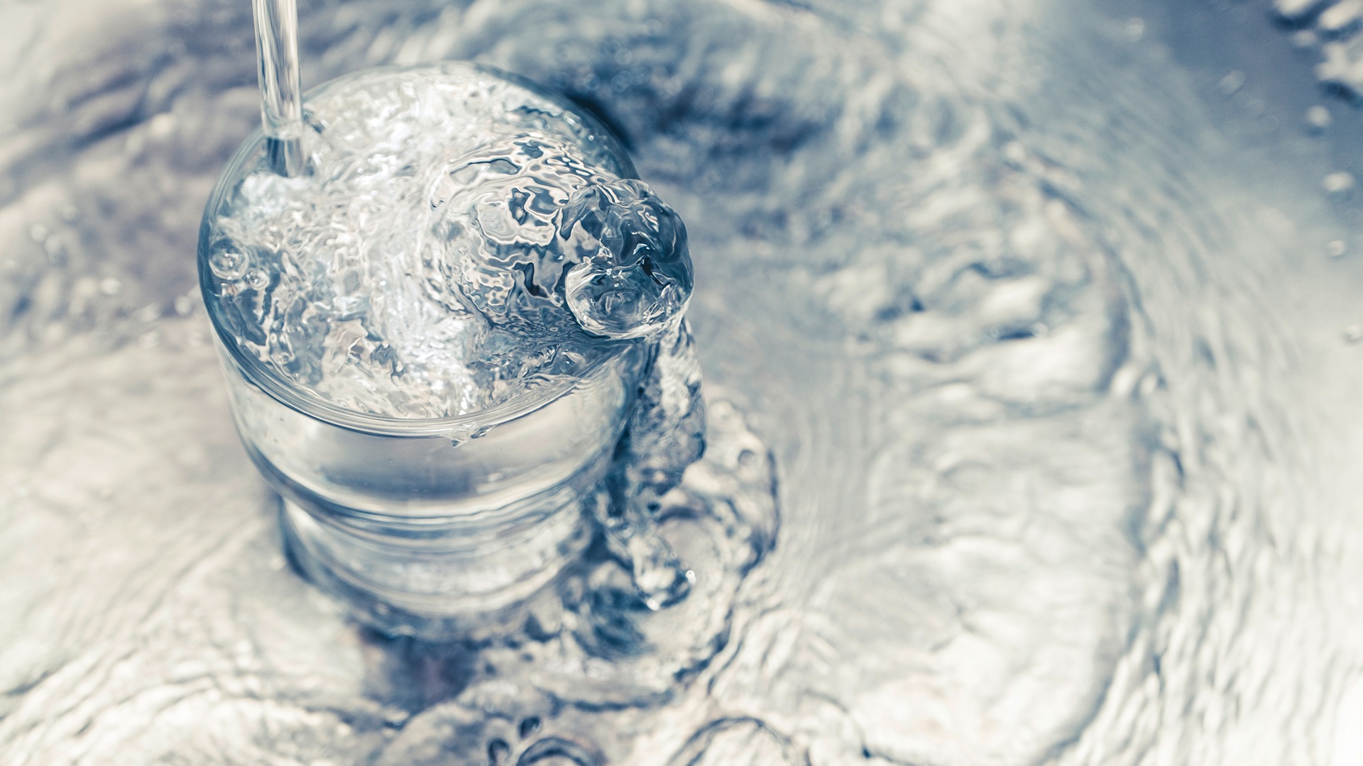 Water inpouring into glass