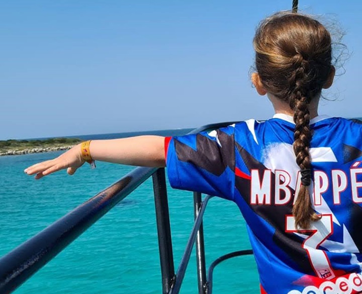 Girl enjoying the beautiful view of the ocean